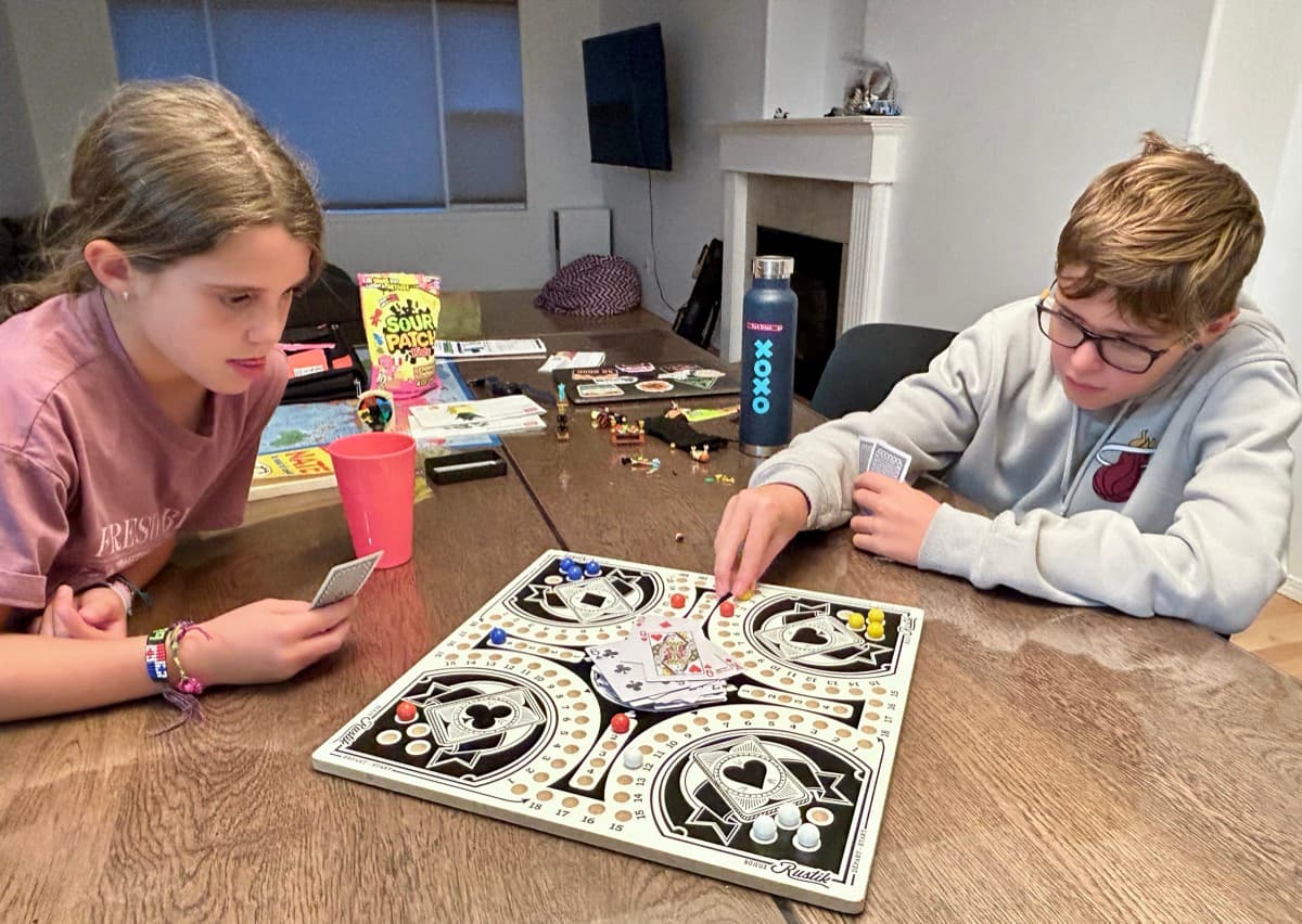My daughter and son playing a board game together