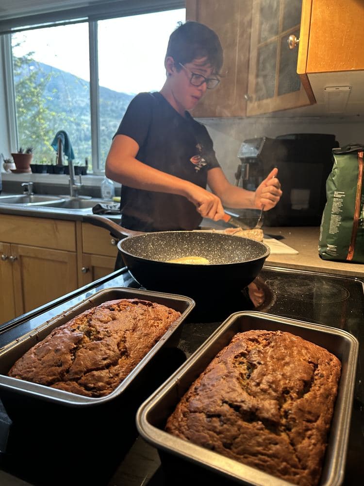 A boy baking banana bread