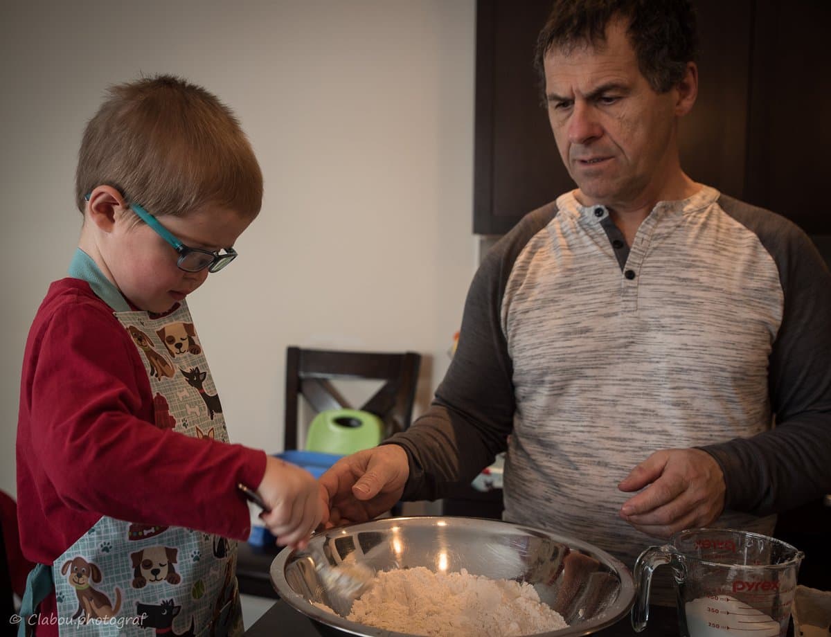 Zach cooking with dad, hands-on involvement in the kitchen
